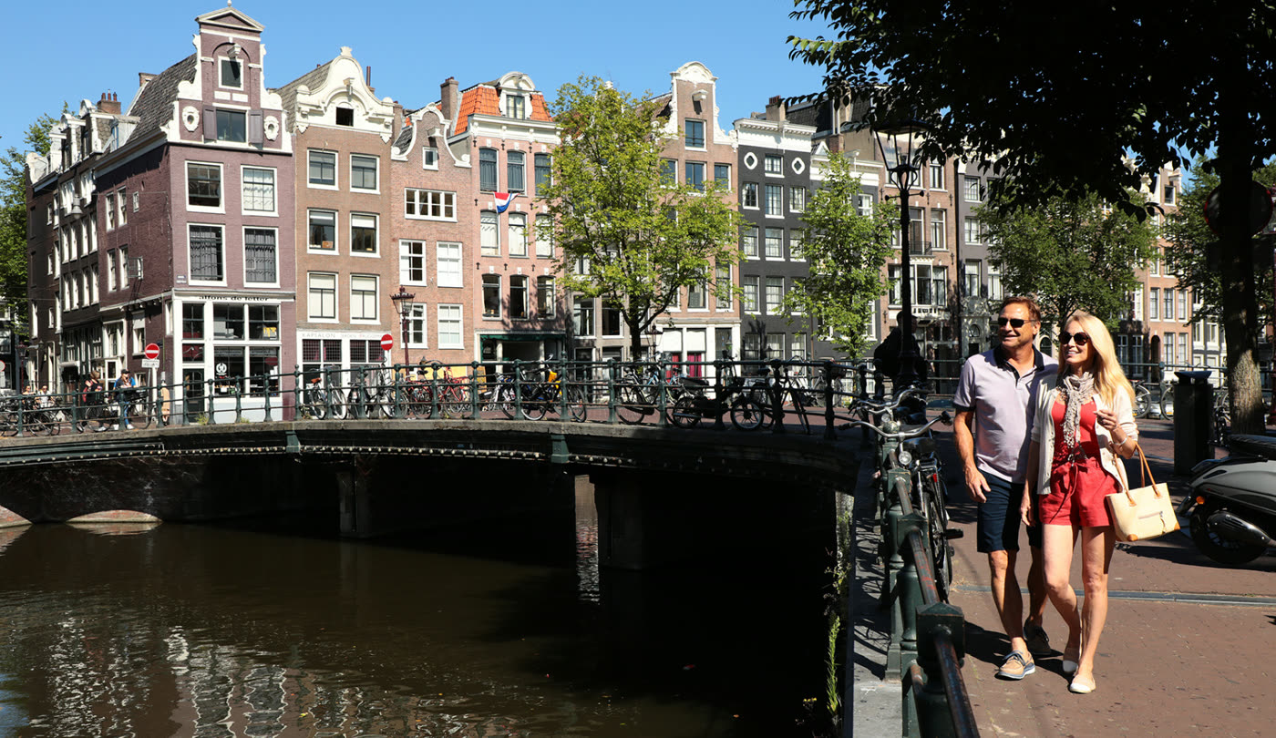 Rosanne and a friend on a bridge over an Amsterdam canal